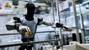 Robot hình người Xiaomi dùng hai tay gắp đai ốc tự ren để lắp ráp ô tô điện tại nhà máy