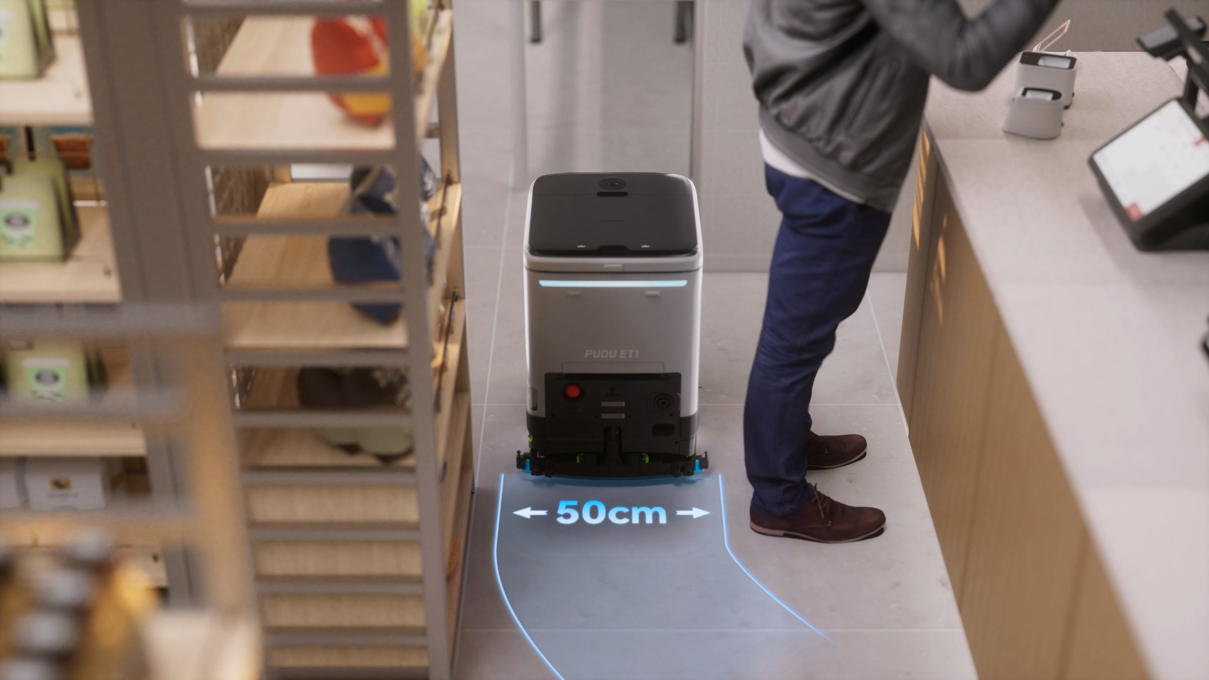 Robot vệ sinh PUDU ET1 đi qua lối đi hẹp khoảng 50 cm